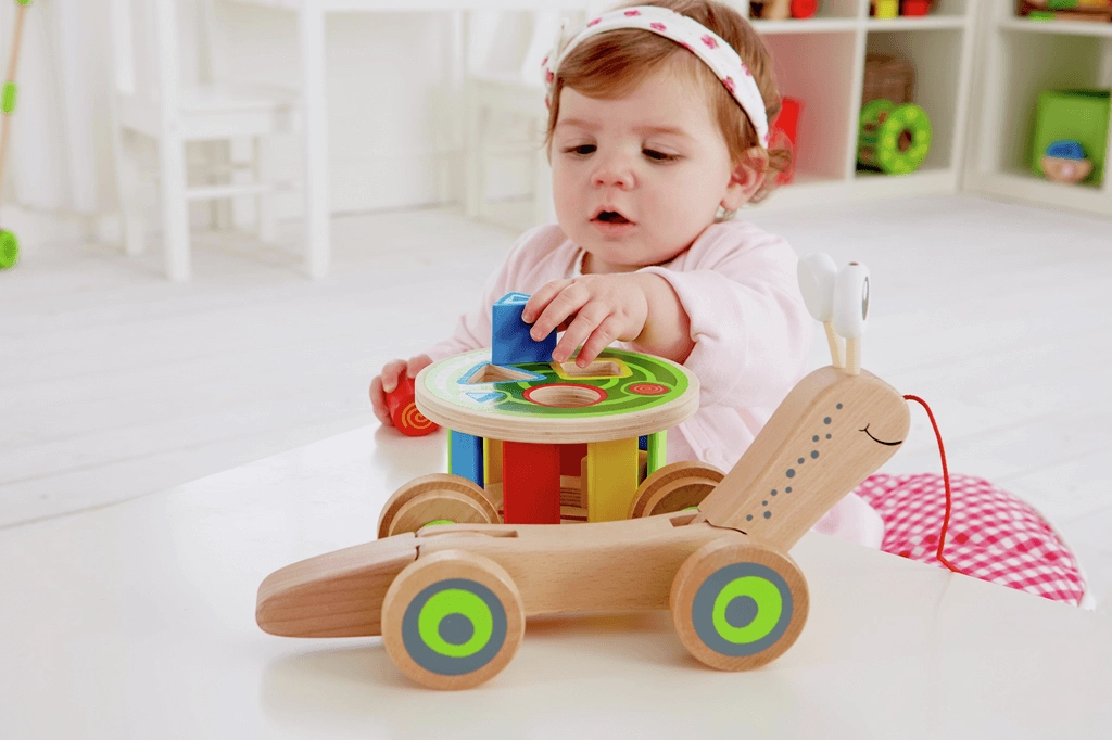 Hape Walk-A-Long Snail Pull Along and Shape Sorter Toy for Ages 1 & Up
